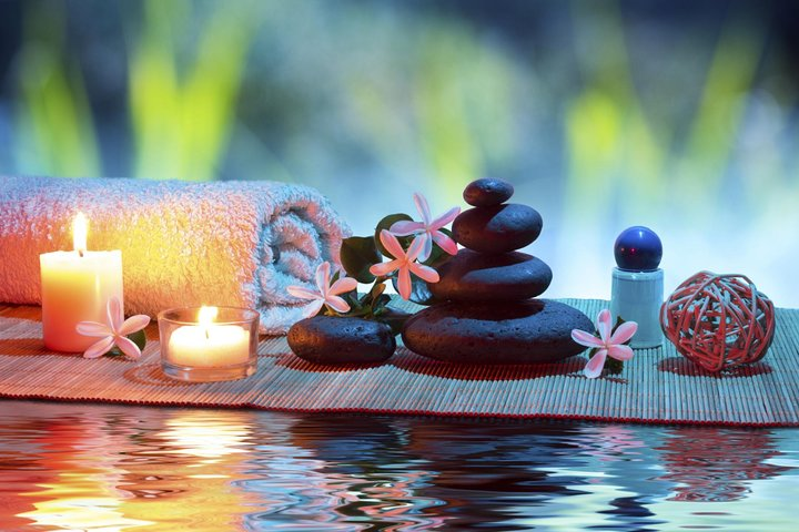 Experience true relaxation with the soothing ambiance of candlelight aromatic stones and delicate blossoms inviting you into a serene world of indulgence and rejuvenation.